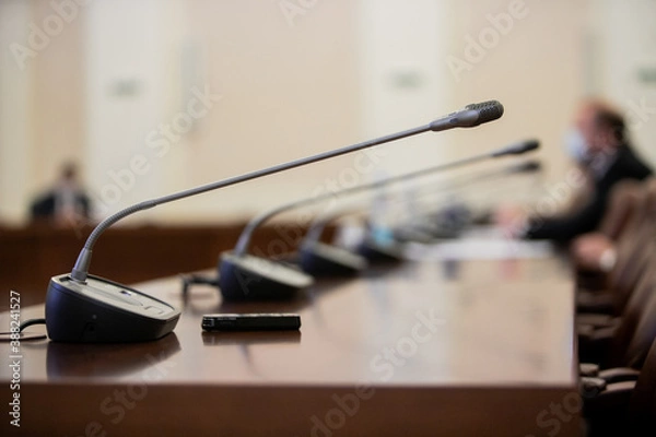 Fototapeta Conference room or seminar meeting room in business event. Session of Government. Academic classroom training course in lecture hall. blur abstract background. working in modern bright office indoor