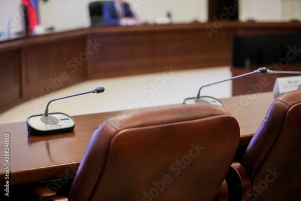 Fototapeta Conference room or seminar meeting room in business event. Session of Government. Academic classroom training course in lecture hall. blur abstract background. working in modern bright office indoor