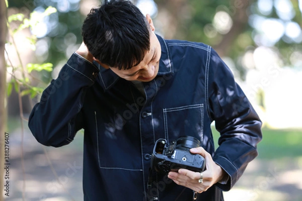 Obraz 電池を忘れたカメラマン