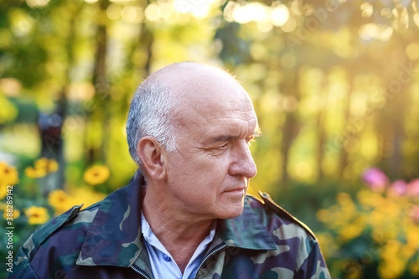 Obraz Closeup portrait of an serious elegant senior man thinking about something at the garden