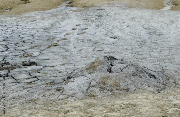 Obraz Landscape with cracked soil from Mud Volcanoes, at Paclele Mari, Romania. Volcanic rocks and lava of mud volcanoes. Lunar landscape in Europe