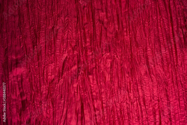 Fototapeta  Red wrinkled taffeta background. Crumpled texture.