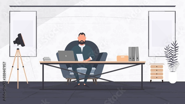Fototapeta A businessman is working on a laptop in his office. Director's workplace. Laptop, documents, books, loft-style table. Vector.