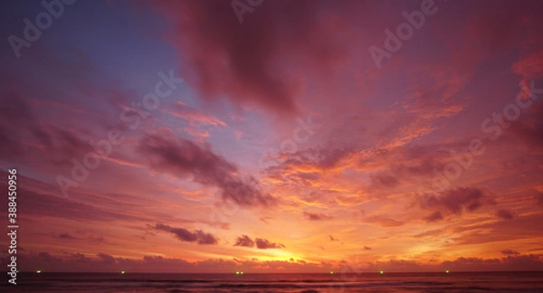 Fototapeta Nature background. Shot of Landscape amazing of red sky sunset in the sea with red clouds background. Travel concept.