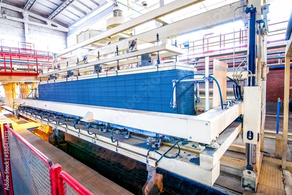 Obraz automated industrial equipment at the factory in production hall