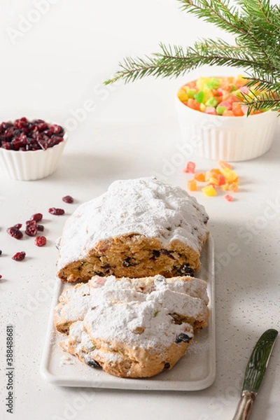 Obraz Christmas stollen - traditional German bread on white background. Close up. Vertical format.