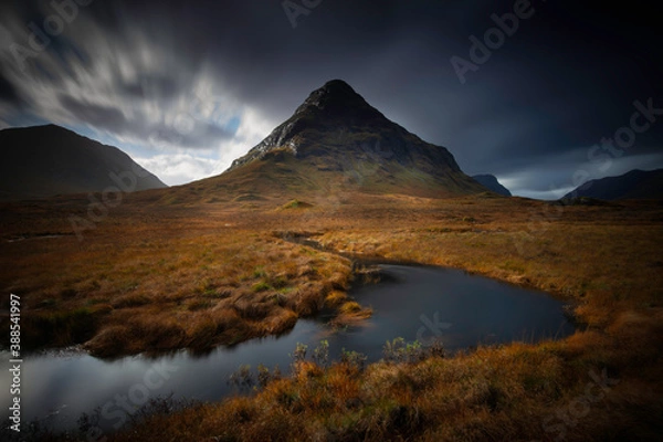 Fototapeta long exposure of the mountain named Bauchaille Etive Beag at lochan na fola in glencoe, highlands, scotland.