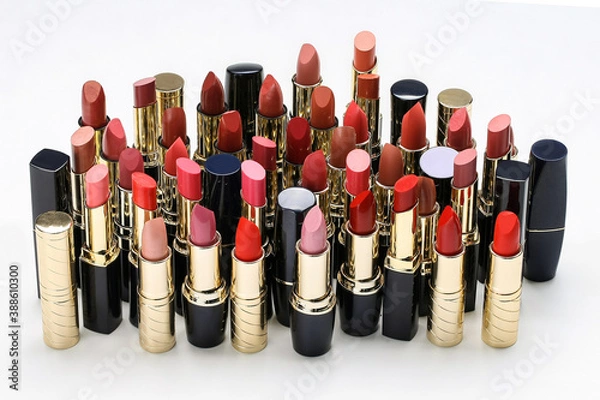 Fototapeta cosmetic lipstick, open tubes on a white background.