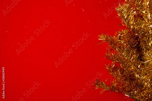 Fototapeta Template for a new year card with a Golden Christmas tree and a red background