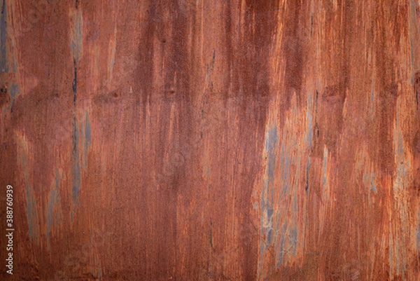 Fototapeta Background of a rusty metal sheet in orange and brown tones with space for text