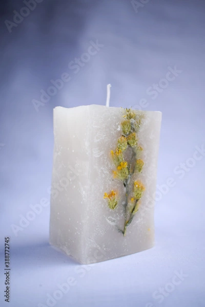 Obraz white decoration candle with a flower inside it with horizontal studio background