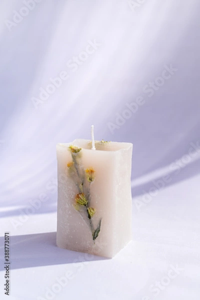 Obraz white decoration candle with a flower inside it and natural light
