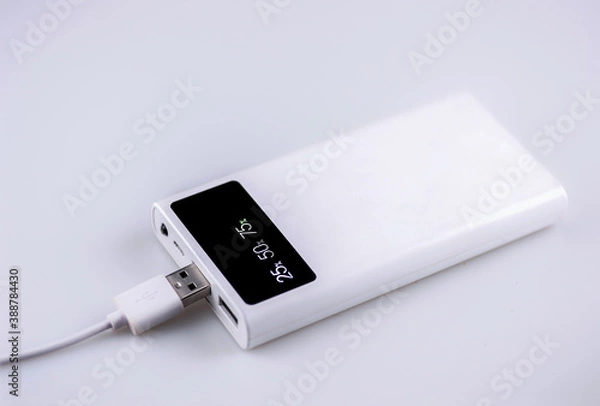 Fototapeta Backup battery or Power Bank for charging mobile devices  With numbers to tell Amount of current