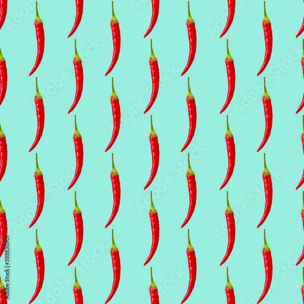 Fototapeta seamless simple pattern of one red hot pepper on blue background