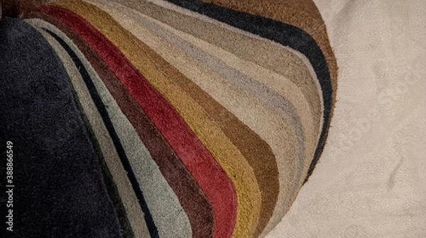 Fototapeta Photo of a set of leather material. Multi-colored samples of genuine leather.  view from above.