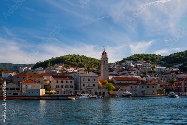 Fototapeta Pucisca is small town on Island of Brac, popular touristic destination on Adriatic sea, Croatia. August 2020.