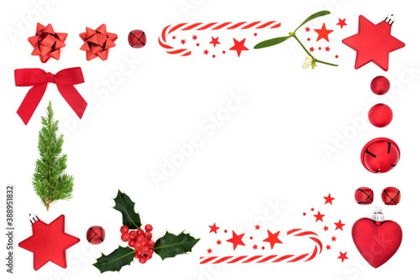 Fototapeta Abstract Christmas border with red bauble decorations, stars, fir, holly & mistletoe on white background. Festive composition for greeting card, gift tag or invitation. Top view, flat lay, copy space.