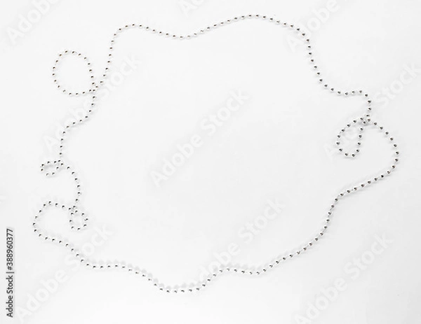 Fototapeta New year decorations for text. Silver beads, chain of on a white background. Christmas concept.