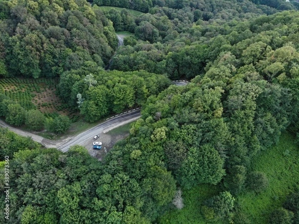 Obraz Aerial view over agricultural fields and road. Dark clouds in the sky