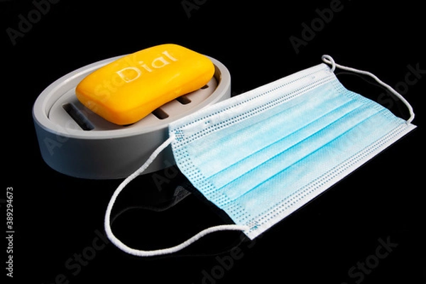 Obraz medical mask lying next to soap