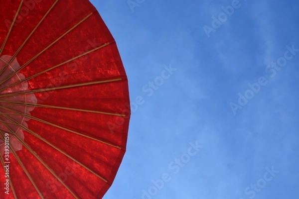 Obraz big red umbrella with sky background