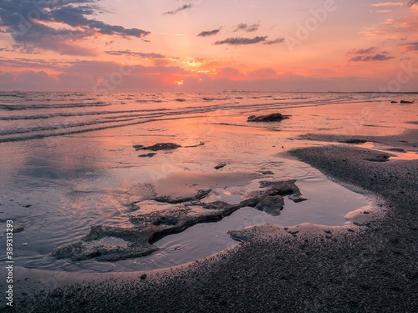 Obraz Golden Seaside Sunrise with Rocks, Waves and Reflections