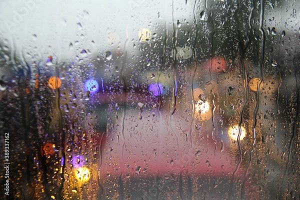 Obraz Raindrops on the windshield of the car. Focus selected. Blur background