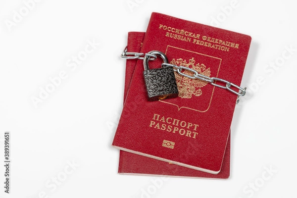 Fototapeta Russian passport with a lock closed on a white background