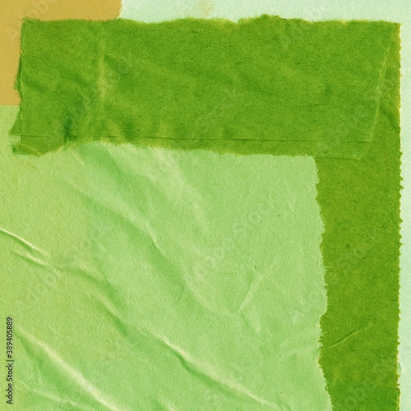 Fototapeta Green torn paper collage close-up. Texture made from various paper and cardboard parts. Damaged old paper background. Vintage blank wallpaper. Material design backdrop.