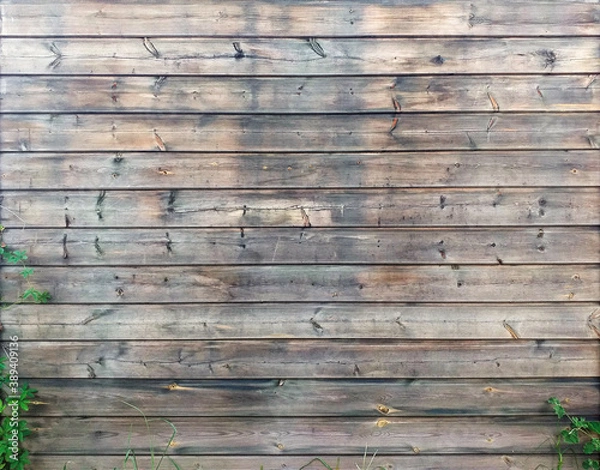 Fototapeta Wall background of horizontal old wooden slats in natural state. Exterior wall or fence of wooden planks. Detail of Caribbean architecture, tropical construction. Wood background.