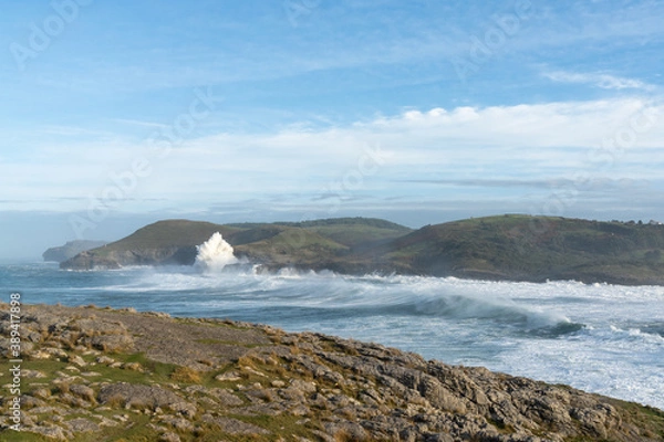Obraz huge waves crashing onto the shores of Cabo de Ajo on the northern Spanish coast