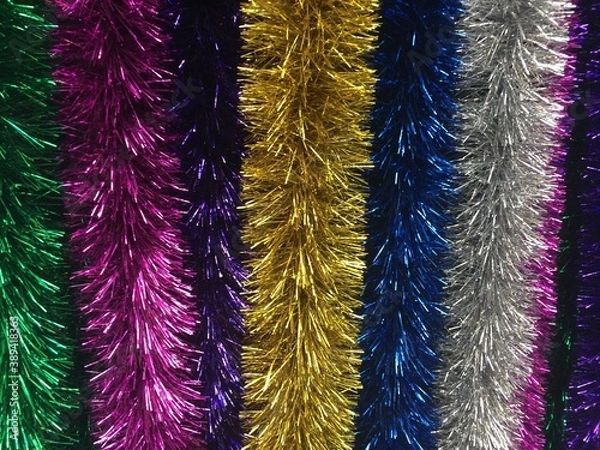 Fototapeta close-up background of a multicolored long tinsel