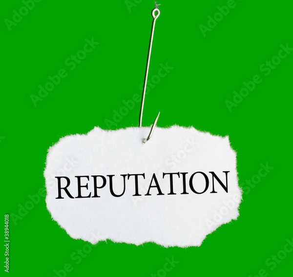 Fototapeta Word REPUTATION on a fishing hook on green background