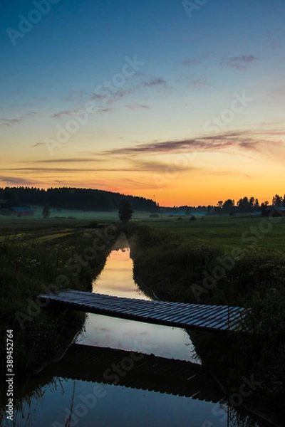 Fototapeta Sunset over river and fields