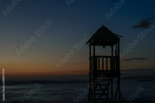 Obraz lifeguard tower at sunset