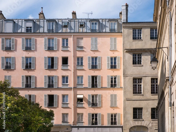 Obraz Architecture in Paris, Blue sky and white clouds, roof and attic room, low-angle shot, historic front buildings windows, artistic view of the city center