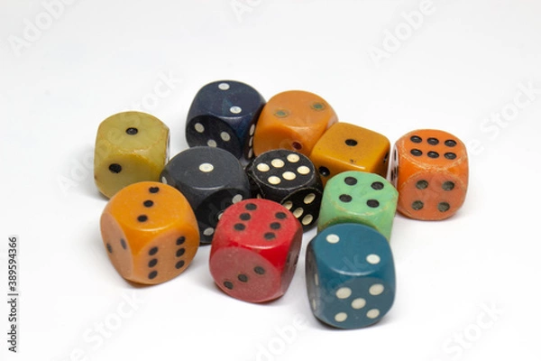 Fototapeta Old colorful dices on a white background