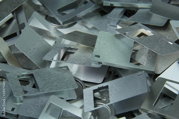 Fototapeta Aluminium parts from old disks to be recycled