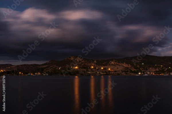 Fototapeta long exposure shot that includes sea, mountain, clouds. sunset or sundown landscape image from Izmir, Turkey.