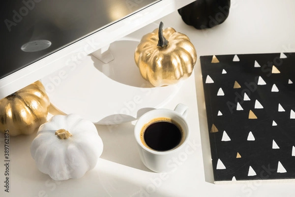 Fototapeta Workplace mock up concept. Modern home decor desktop computer with autumn decorations. Paper boxes in a trolley on the desktop. Online shopping concept