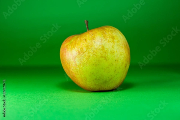 Obraz Apple on a green background