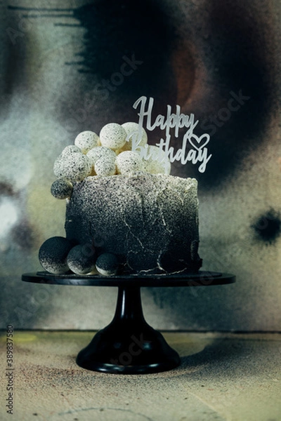 Fototapeta black and white birthday cake in bakery