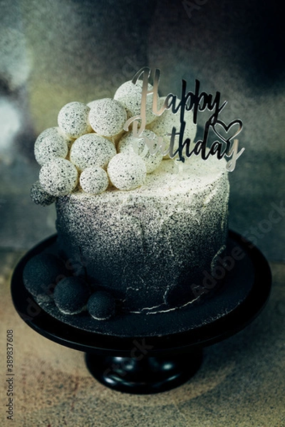 Fototapeta black and white birthday cake in bakery