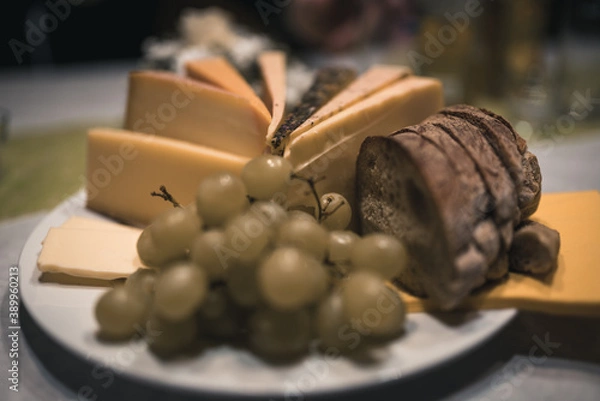 Obraz cheese plate with bread and grapes