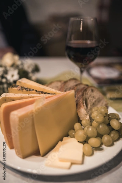 Obraz cheese plate with bread and grapes