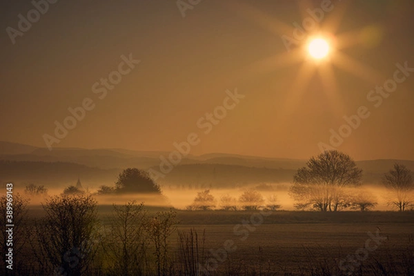 Fototapeta ground fog, lines of fog over the landscape, czech country, early spring,  winter, 