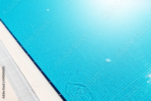 Fototapeta Sunny swimming pool in tropical resort