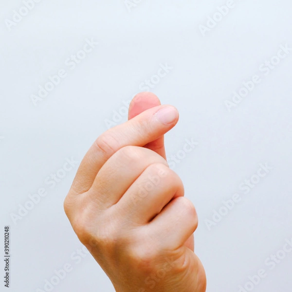 Fototapeta hands making a small heart on a white isolated background
