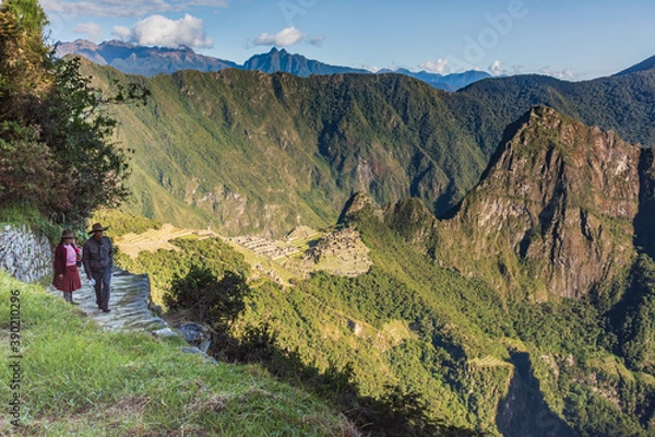 Obraz July 2018. Machu Picchu, Cusco. Peru. 
Locals starting their day with the sunrise at one of the Modern Wonders of the world.