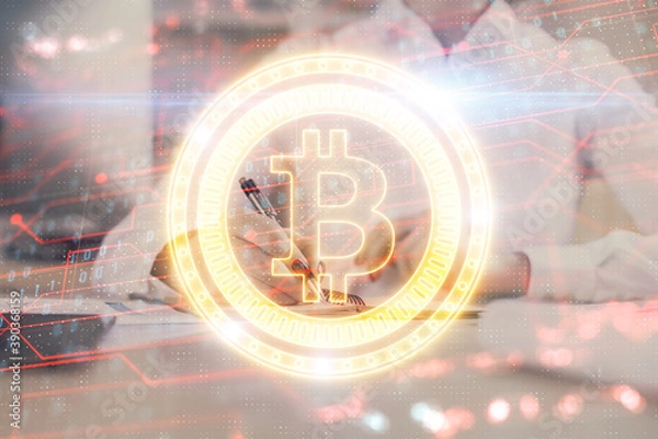 Obraz Cryptocurrency hologram, bitcoin, ico theme over hands taking notes background. Concept of blockchain. Multi exposure
